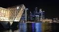 Modern buildings and lights on sea and abstract architectures and night skyline in Singapore