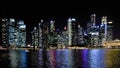 Modern buildings and lights on sea and abstract architectures and night skyline in Singapore