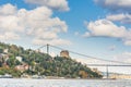 Modern builings and Rumelian Castle, and Fatih Sultan Mehmet Bridge across the Bosphorus strait in Istanbul Turkey from ferry on a Royalty Free Stock Photo