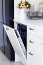 modern built-in dishwasher in beautiful white kitchen Royalty Free Stock Photo