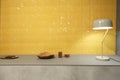 A modern built in recessed wall niche concrete grey color shelf with a stylish desk table lamp and two wooden trays on it and a