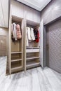 Modern built in wardrobe with closet. Assortment of Russian fur coats
