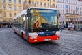 A modern bus rounds a corner on the cobbled streets of the old town district of Prague Royalty Free Stock Photo