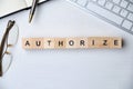 Modern business buzzword - authorize. Top view on wooden table with blocks. Top view