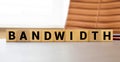 Modern business buzzword - bandwidth. Top view on wooden table with blocks. Top view. Close up.