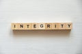 Modern business buzzword - integrity . Top view on wooden table with blocks. Top view