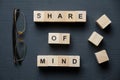 Modern business buzzword - share of mind. Top view on wooden table with blocks. Top view