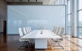 Modern business conference room with a long white rectangular table and high-backed chairs in sleek white Royalty Free Stock Photo