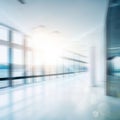 Modern business grey blurred or defocus glass wall from building background with light effect.