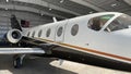 Modern business jet leaves the hangar for departure Royalty Free Stock Photo