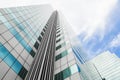 Modern business office building with glass windows reflect the skyline that view from below in Bangkok, Thailand Royalty Free Stock Photo