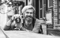 Modern business. Old technology. Professional photographer use vintage camera. Photography business. Bearded man hipster Royalty Free Stock Photo