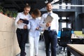 Modern business people discussing business and smiling while walking through the office corridor Royalty Free Stock Photo