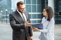 Modern business. Business team brainstorming. Successful business man and young woman communicating Royalty Free Stock Photo