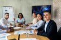 Modern Business Team. Group Of Multiethnic Colleagues Sitting At Desk In Office Royalty Free Stock Photo