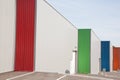 Business units with colorful roller doors building