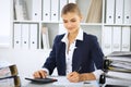 Modern business woman or confident female accountant in office. Student girl during exam preparing. Audit, tax service Royalty Free Stock Photo