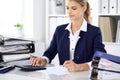 Modern business woman or confident female accountant in office. Student girl during exam preparing. Audit, tax service Royalty Free Stock Photo