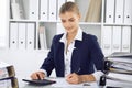 Modern business woman or confident female accountant in office. Student girl during exam preparing. Audit, tax service Royalty Free Stock Photo