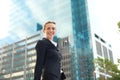 Modern business woman smiling and walking outside Royalty Free Stock Photo