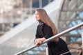 Modern business woman standing near modern office building Royalty Free Stock Photo