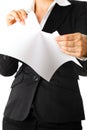 Modern business woman tearing sheet of white paper