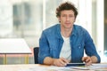 Modern business. A young man working on a digital tablet in the office. Royalty Free Stock Photo