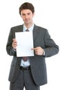 Modern businessman pointing on blank paper sheet Royalty Free Stock Photo