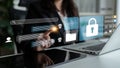 Modern Businesswoman Interacting with Digital Security Interface in High-Tech Office Setting Focusing on Data Protection Royalty Free Stock Photo