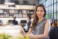 Modern businesswoman at the office, smiling female boss posing for a company photograph, self-assured successful woman at work