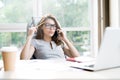 Modern Businesswoman Speaking by Phone in Office Royalty Free Stock Photo