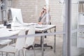 Modern Businesswoman Speaking by Phone in Office Royalty Free Stock Photo