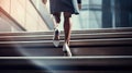 a modern businesswoman& x27;s legs as she confidently climbs a staircase in the heart of a bustling city. ample space Royalty Free Stock Photo