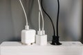 Modern cable connector for overloaded power boards at home. The extension cord is filled with sockets Royalty Free Stock Photo