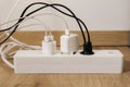 Modern cable connector for overloaded power boards at home. The extension cord is filled with sockets Royalty Free Stock Photo