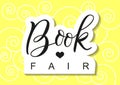 Modern calligraphy lettering of Book Fair in black with outline in paper cut style on yellow background with swirls
