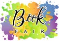 Modern calligraphy lettering of Book Fair in black with white outline on colorful background
