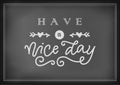 Modern calligraphy lettering of Have a nice day in white with arrows and hearts on chalkboard background Royalty Free Stock Photo