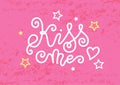 Modern calligraphy lettering of Kiss me in white with heart and stars on pink textured background