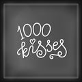 Modern calligraphy lettering of 1000 kisses in white on chalkboard background