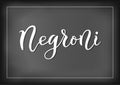 Modern calligraphy lettering of Negroni in white on chalkboard background with white frame