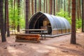 modern camping pod in a pine forest Royalty Free Stock Photo
