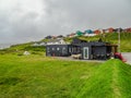 Modern camping site at the seashore of Torshavn in Faroe islands, summer time, Atlantic ocean