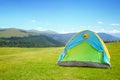 Camping tent in mountains on sunny day Royalty Free Stock Photo