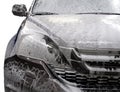 Modern car covered by foam. Royalty Free Stock Photo