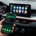 Modern car dashboard displaying connected smartphone interface Royalty Free Stock Photo