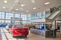 Modern Car Dealership Interior with Red Sedan Display, Noblesville