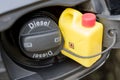 Modern car details closed fuel cap with Diesel text marking and small canister