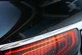 Modern car headlight of a black luxury car close up Royalty Free Stock Photo