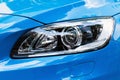 Modern car headlight, Blue car exterior detail